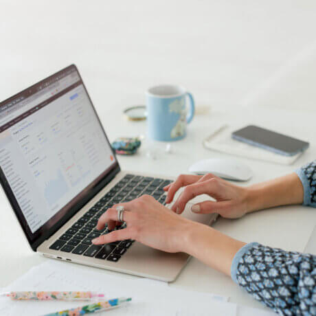 Wedding SEO expert types on computer