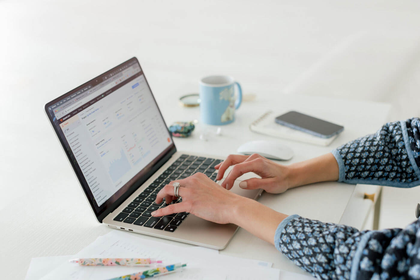 Wedding SEO expert types on computer