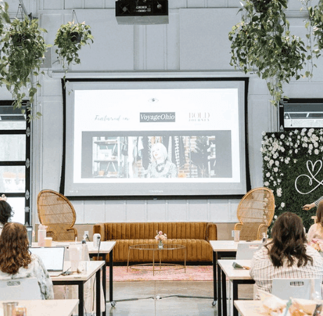 Wedding PR expert Meghan Ely speaking at an industry event about publicity strategies