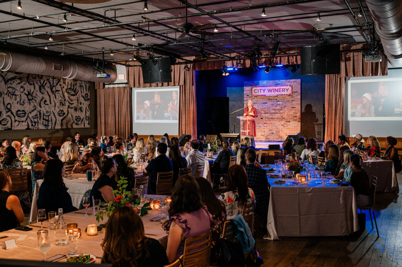 Meghan Ely speaking to a room of wedding professionals at WIPA Chicago